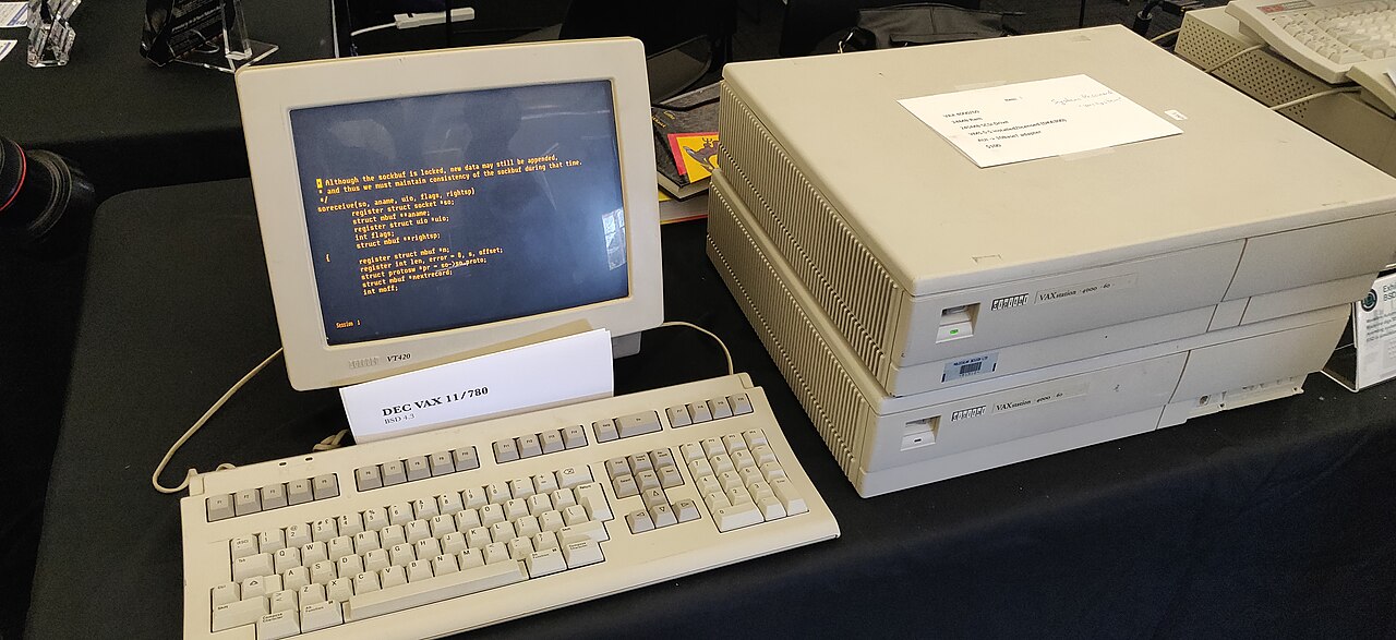 A vintage computer workstation with a CRT terminal